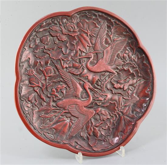 A Chinese red lacquer pentafoil shaped dish, width 28cm